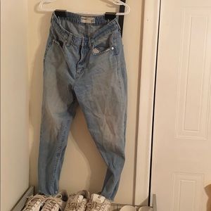 Mom jeans with frayed bottoms